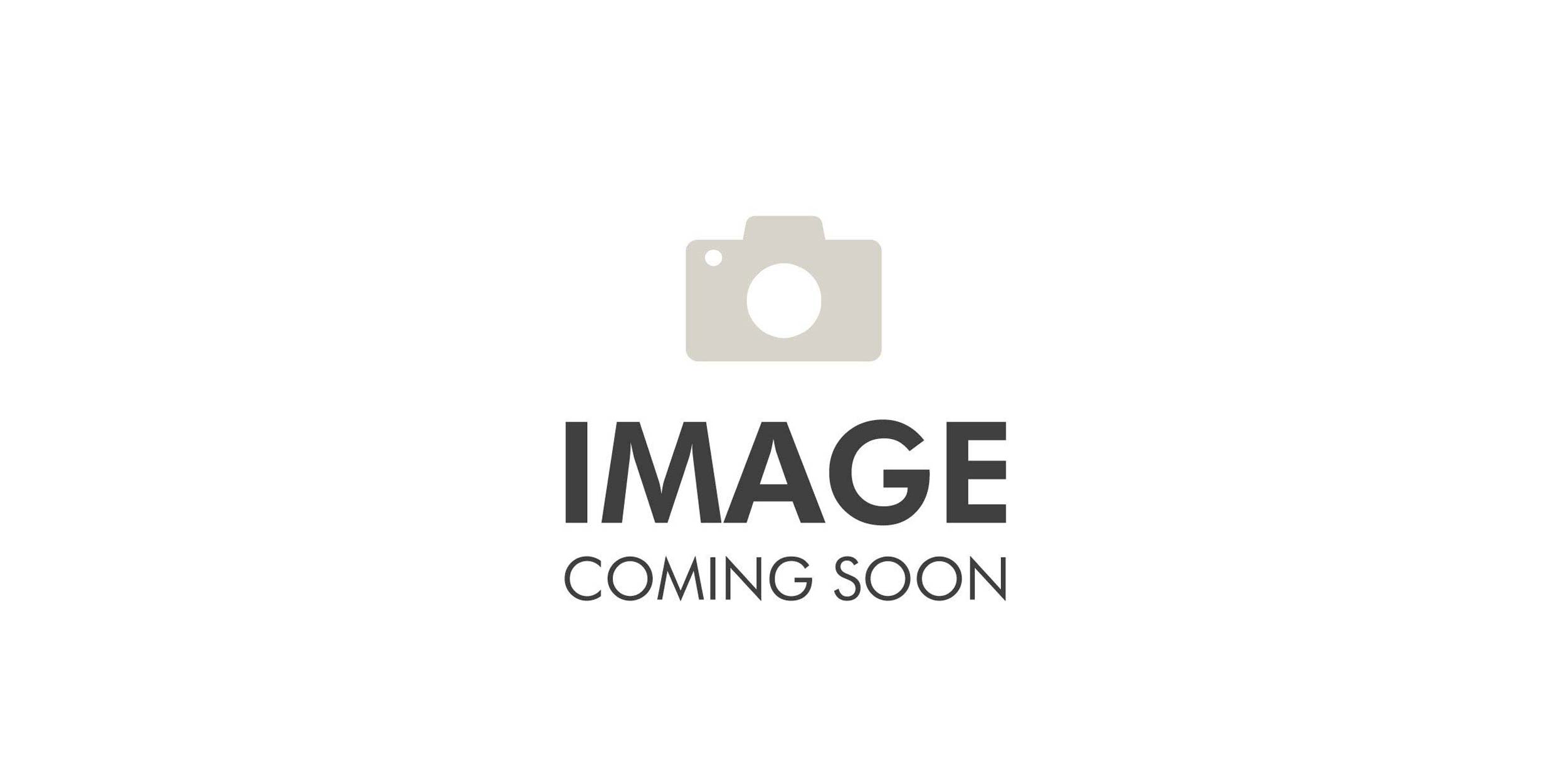 Indoor golf simulator setup with a large screen, golf clubs, and a putting green area.