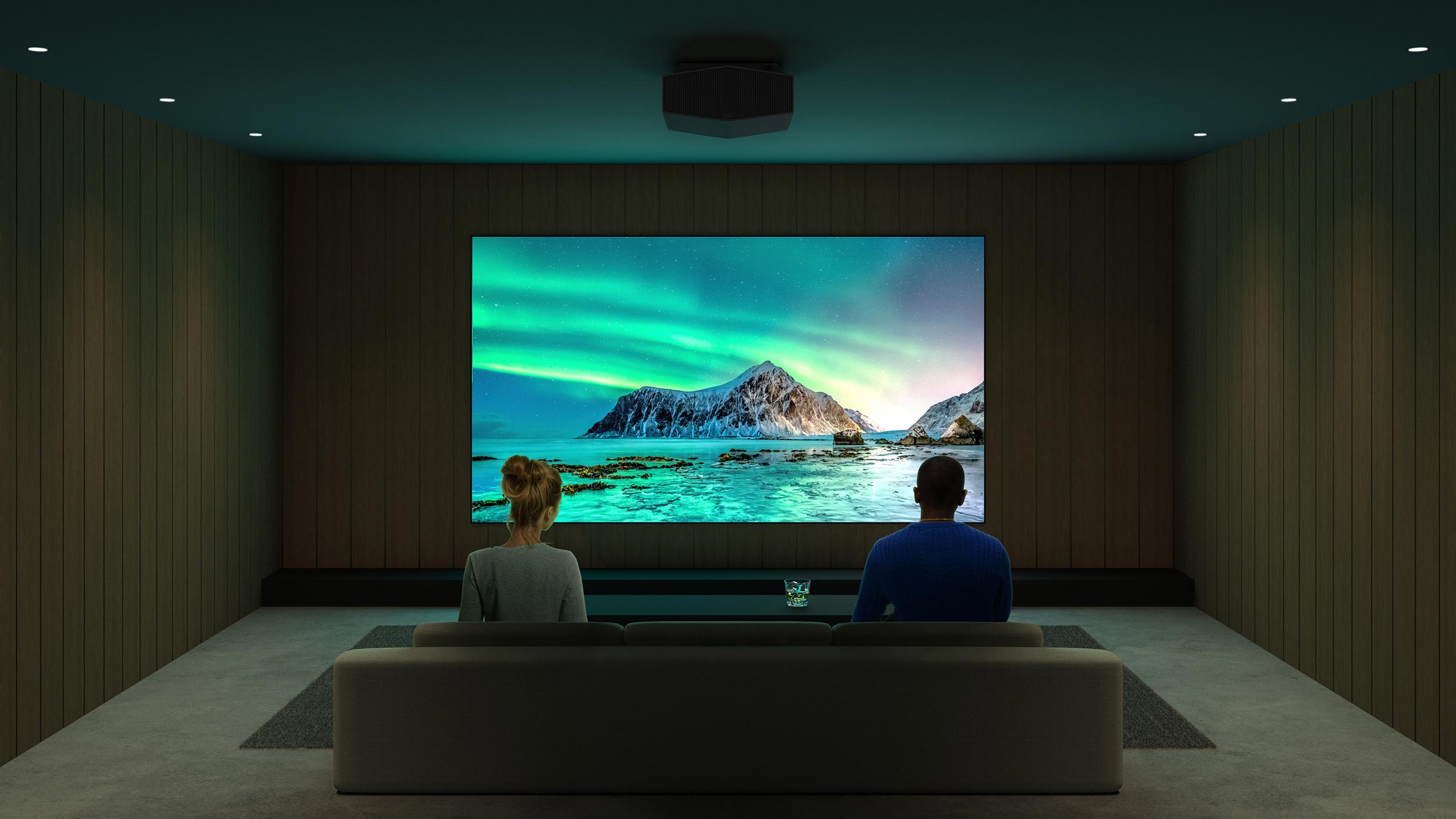 A minimalistic home theater with wood paneling and a ceiling projector displaying the northern lights.