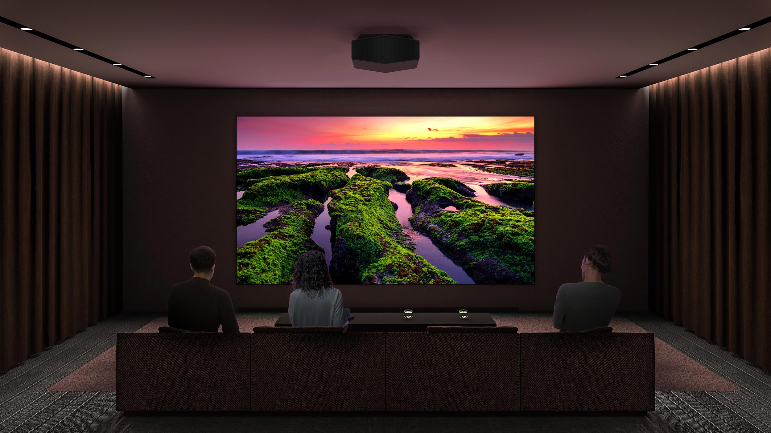 A dark home theater room with curtains, a ceiling projector, and a vivid sunset scene on a large screen.