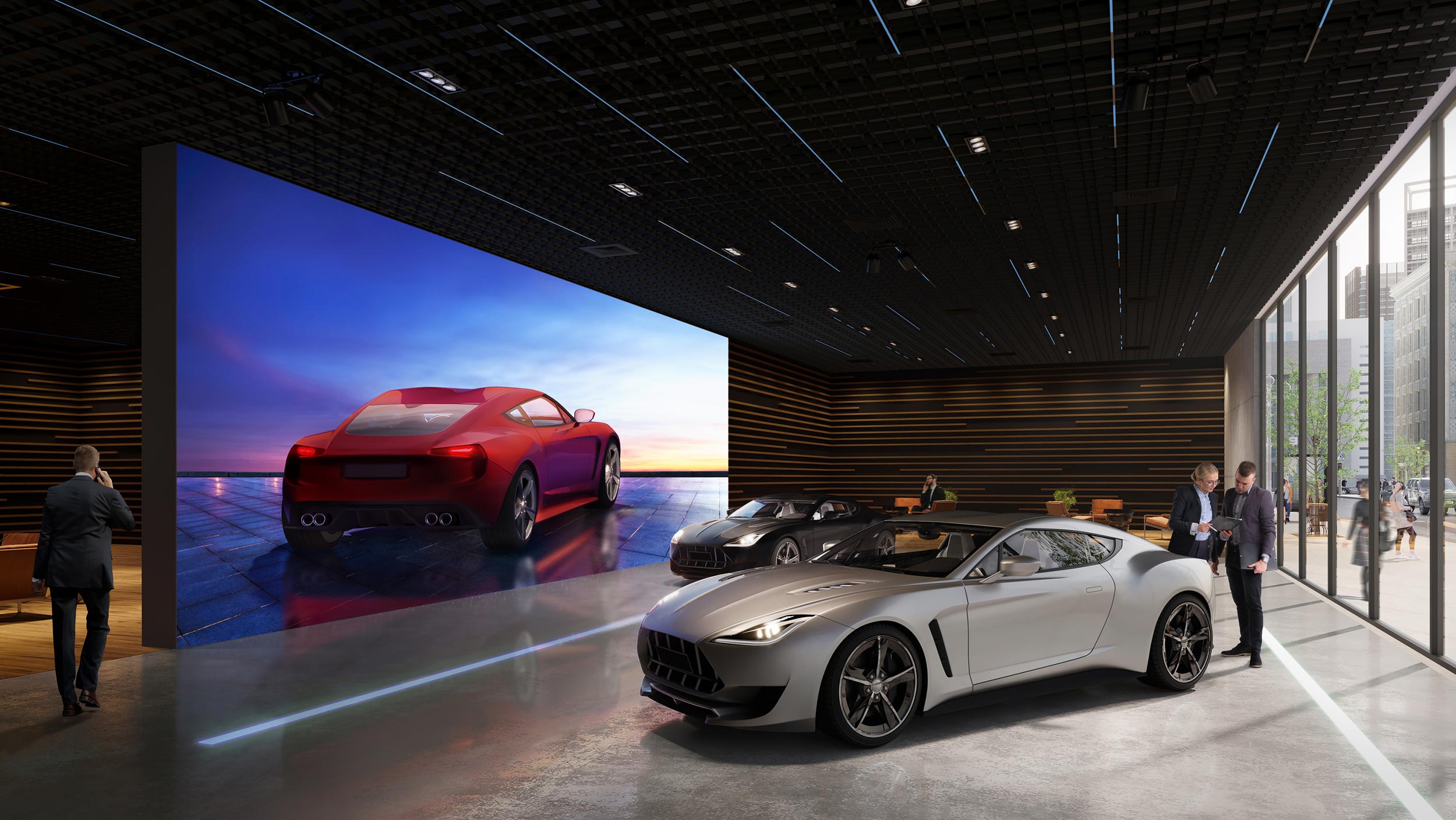 A Sony video wall in a high-end car showroom showcasing a sports car against a vibrant sunset backdrop.