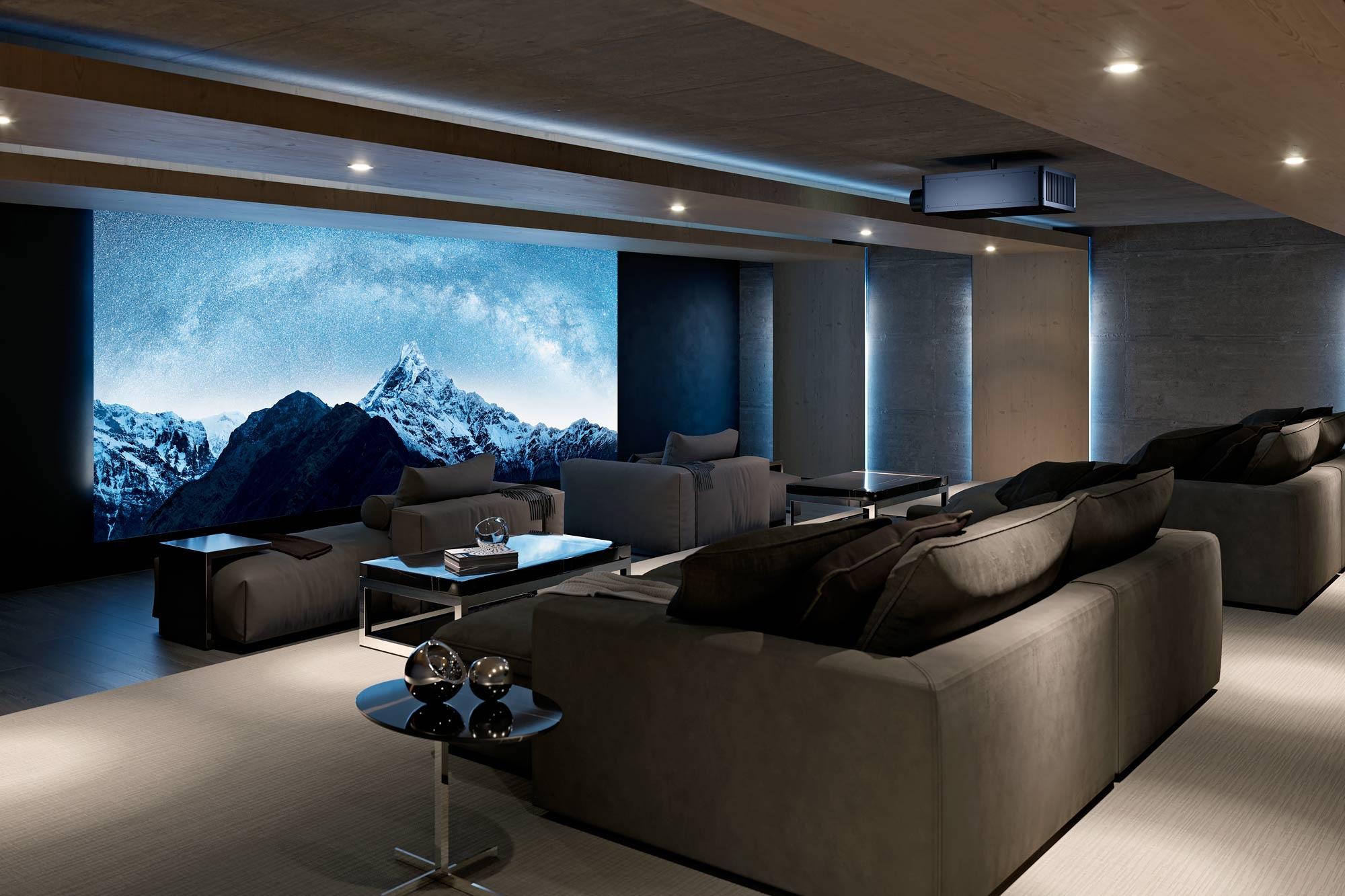 A modern home theater with plush seating, a large projection screen displaying a starry mountain scene, and ambient lighting.